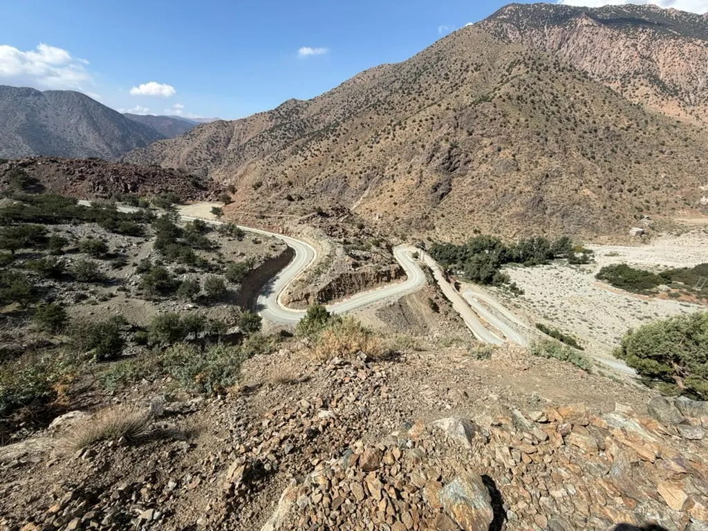 Hairpin bends on a mountain road through dry High Atlas hills south of Marrakech